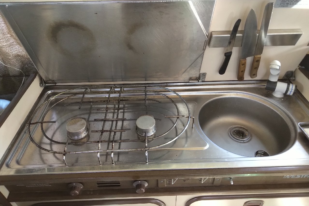 Stove and sink context for comparing layout safety, heat, and clearance