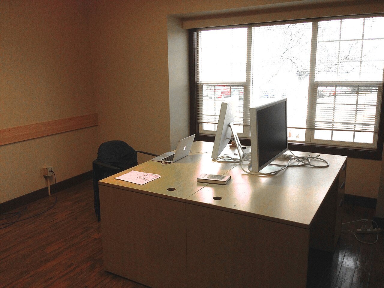 Desk facing window context for checking light, glare, and focus