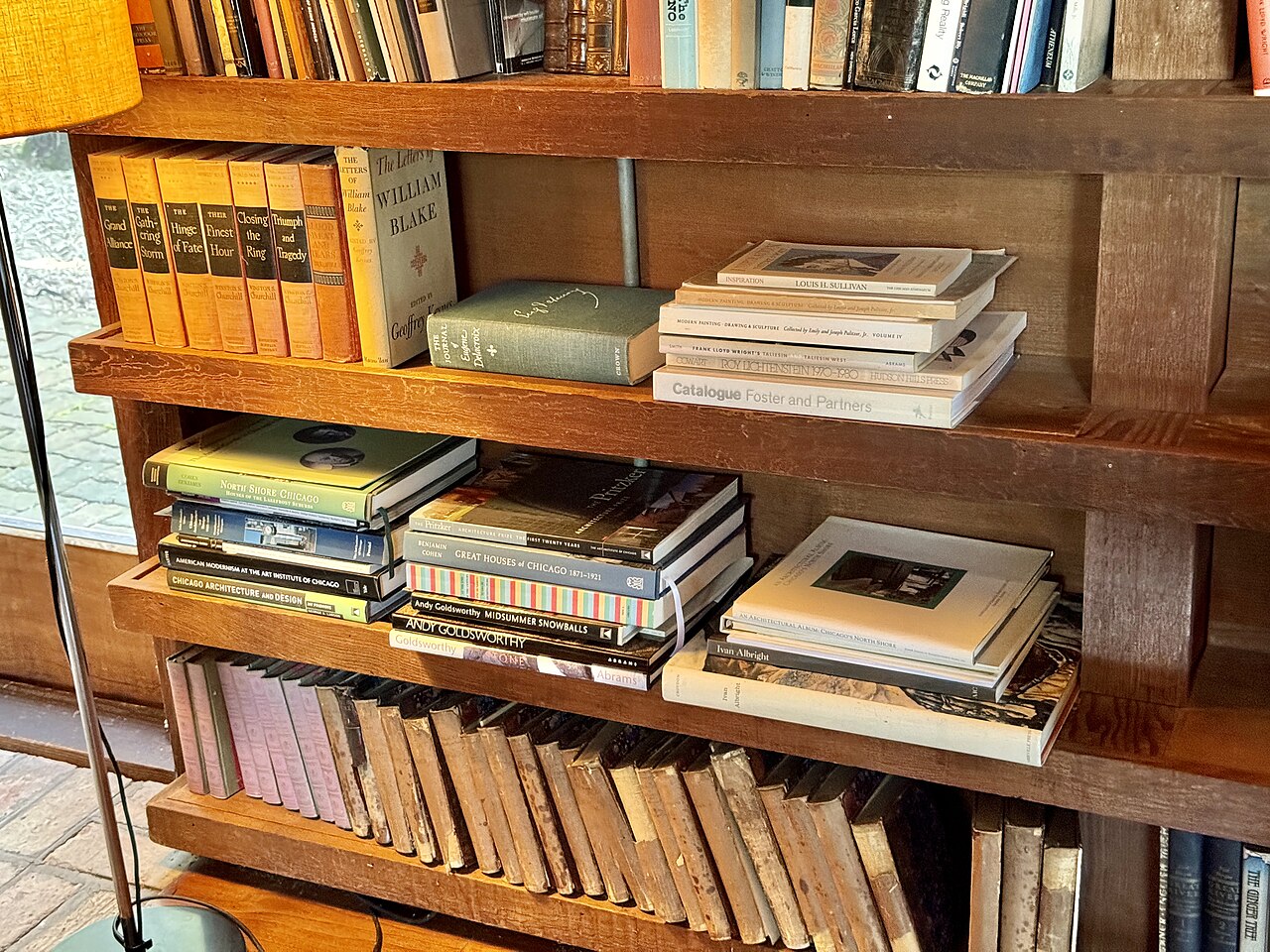 feng shui bookshelf placement opening image showing bookshelf living room in a clear landscape context