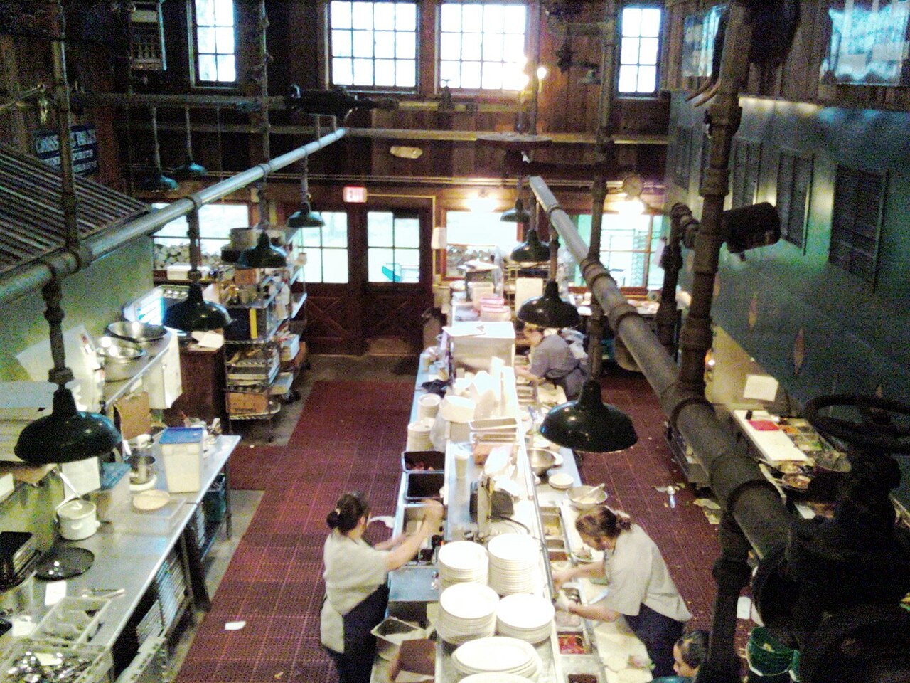 Restaurant feng shui layout kitchen-to-dining service boundary with pass window and tables