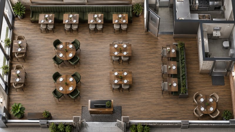 Top-down restaurant floor showing table spacing, kitchen access, and circulation paths